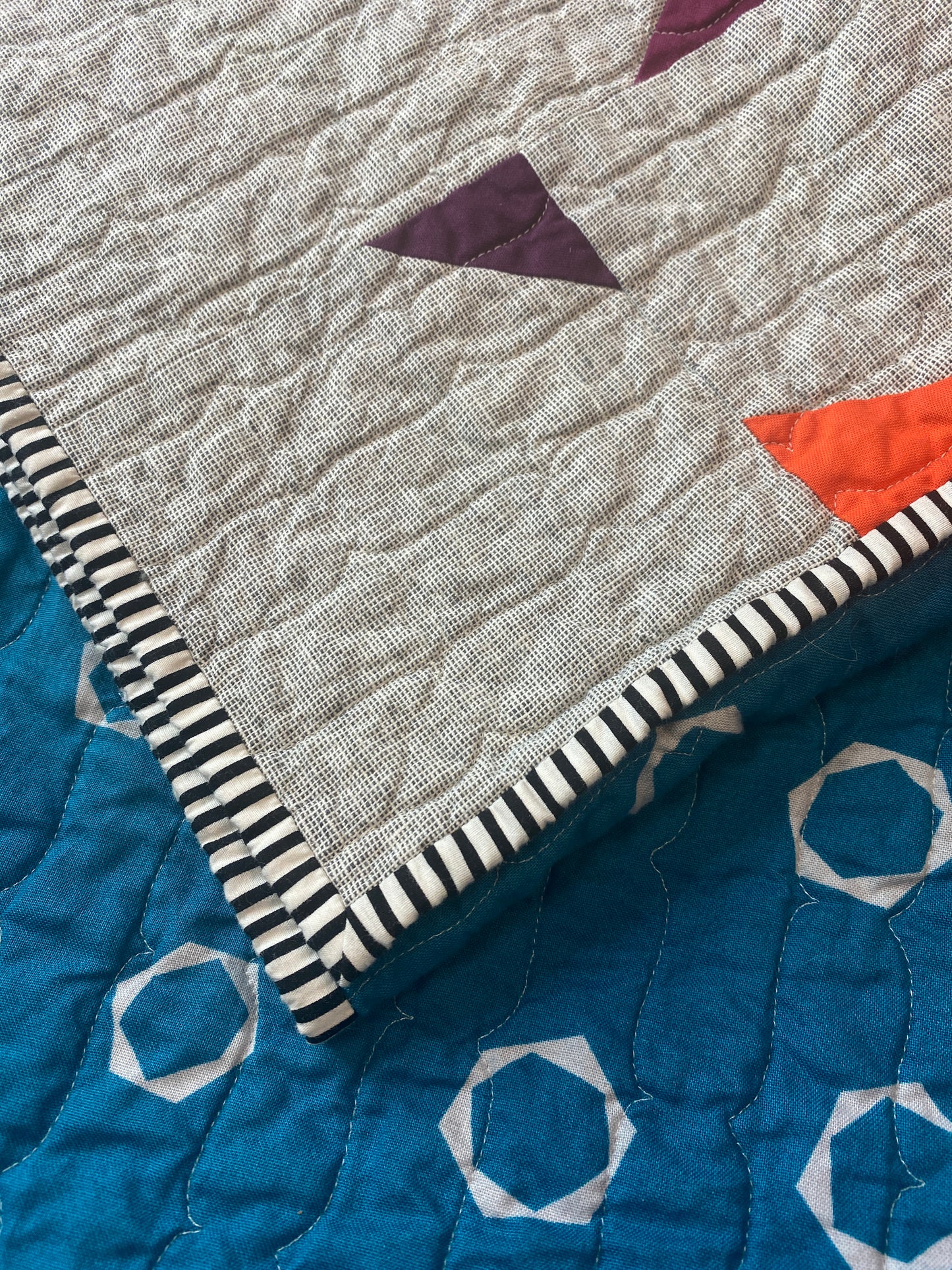 Handmade quilt with modern improv triangle design – Tipsy Triangles