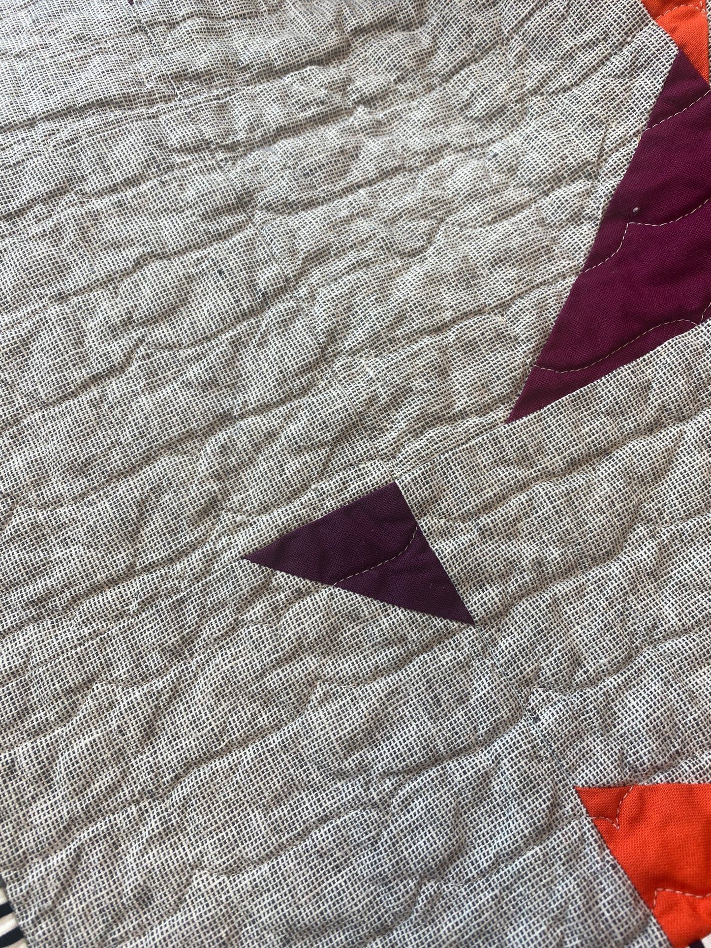 Handmade quilt with modern improv triangle design – Tipsy Triangles