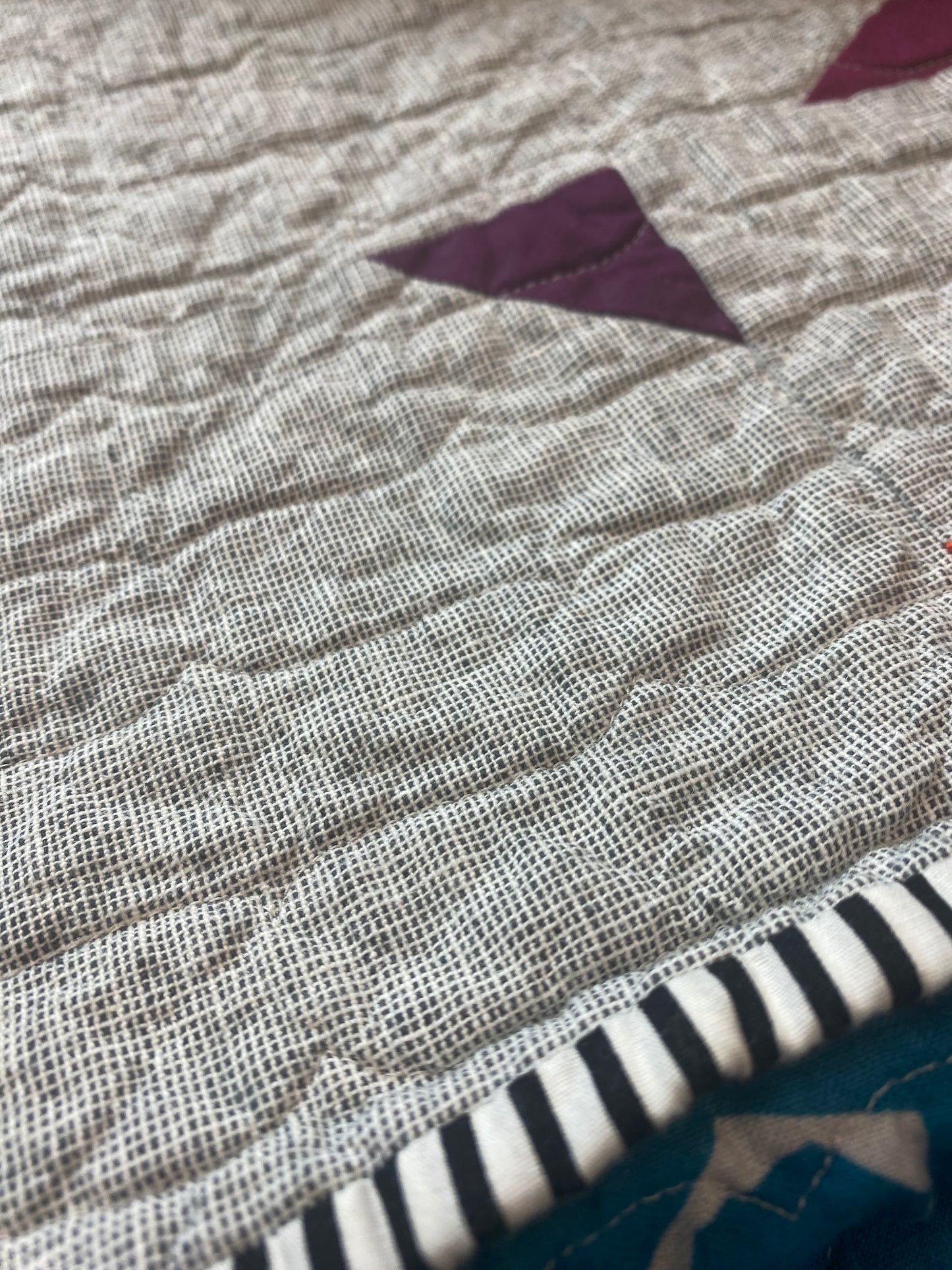 Handmade quilt with modern improv triangle design – Tipsy Triangles