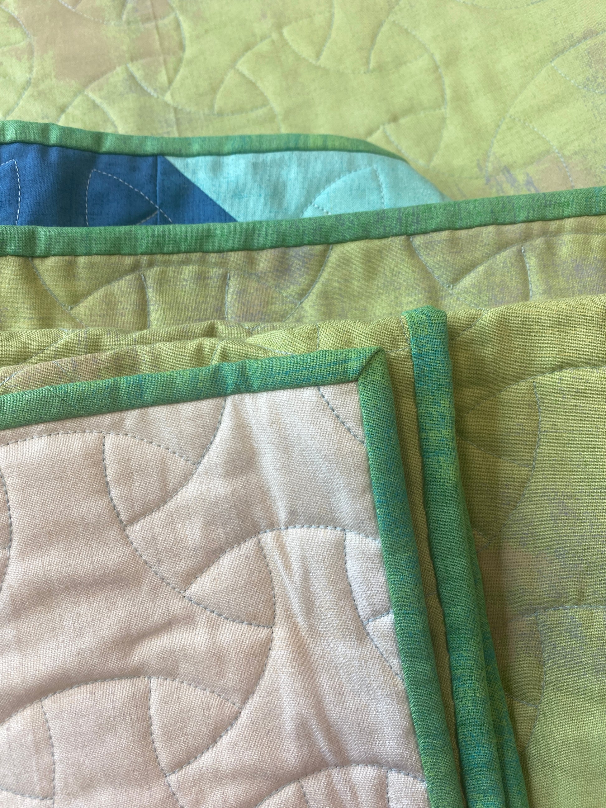 Quill handmade quilt with modern feather design in Grunge solids