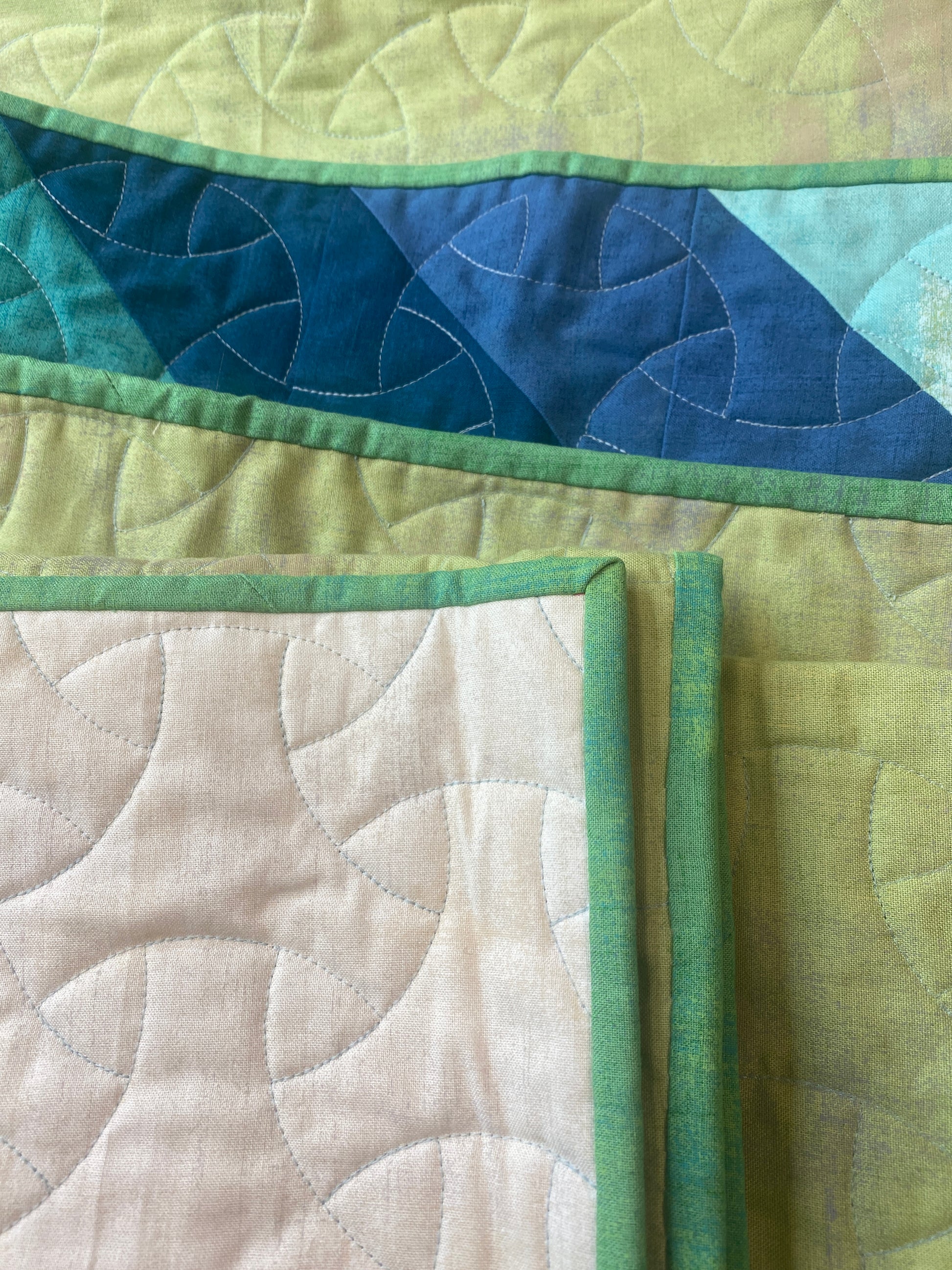 Quill handmade quilt with modern feather design in Grunge solids