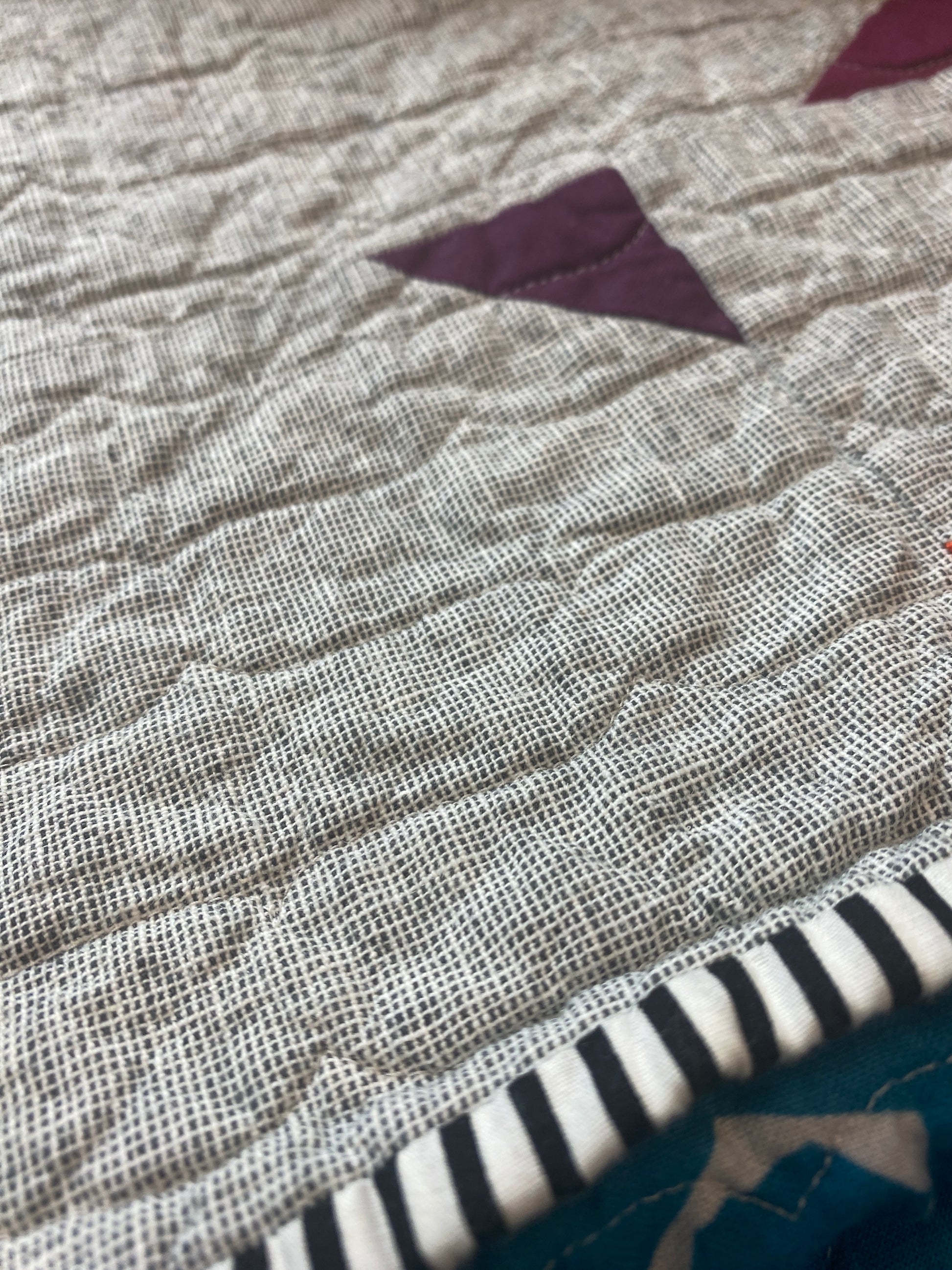 Handmade quilt with modern improv triangle design – Tipsy Triangles